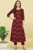 A woman's long-sleeved printed cotton kameez with a high neck, matching pants