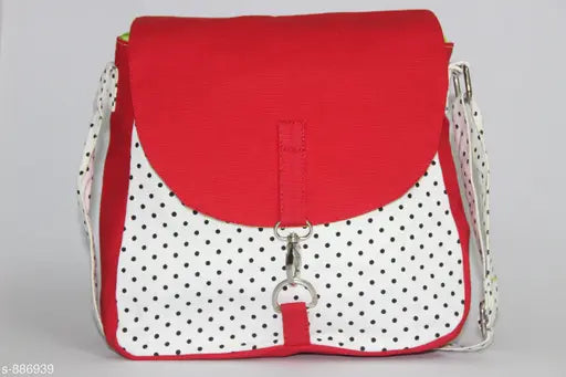 Red and white polka dot sling bag with a red strap
