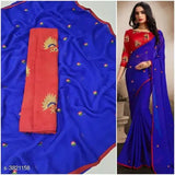 Trendy moss chiffon saree, embellished net pattern, silk blouse on mannequin. Indian fashion wear