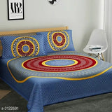 Trendy cotton printed double bedsheet with pillow covers, vibrant design on bed and pillows