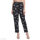 Black printed pyjama pants with floral pattern, mid-thigh length, elastic waistband