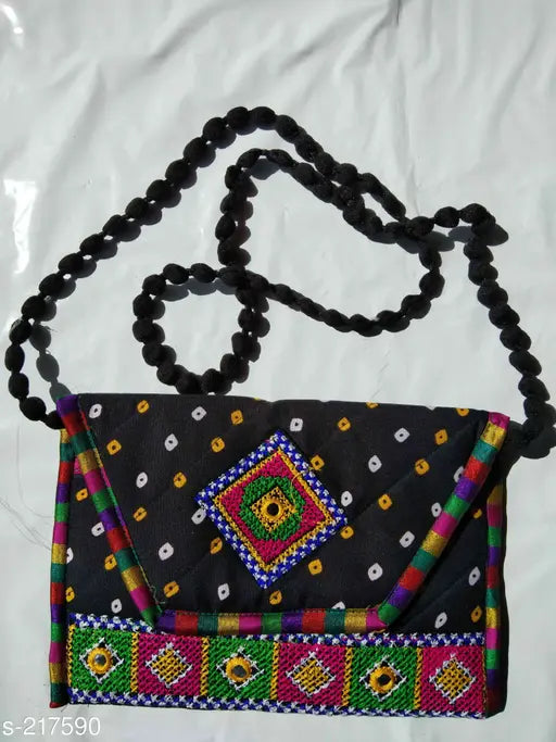 Black kutchi work sling bag with floral designs and tassels