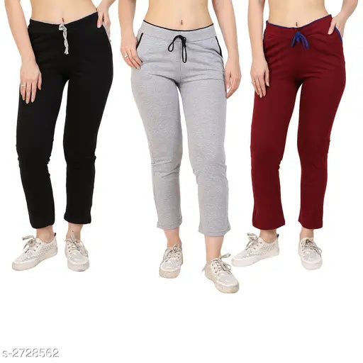 Cotton, solid-colored womens pyjamas in three different hues. Includes pants and matching shirts