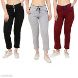 Cotton, solid-colored womens pyjamas in three different hues. Includes pants and matching shirts