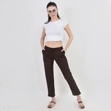 White cropped top, brown high-waisted trousers