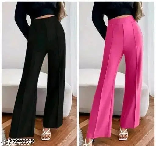 Black cotton trousers with a zip fly, elastic waistband and side pockets