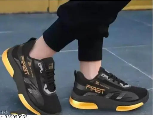 Black high-top sneakers with white sole and yellow accents, casual style