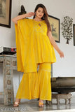 A person wearing a yellow kameez with ruffle sleeves and a matching dupatta