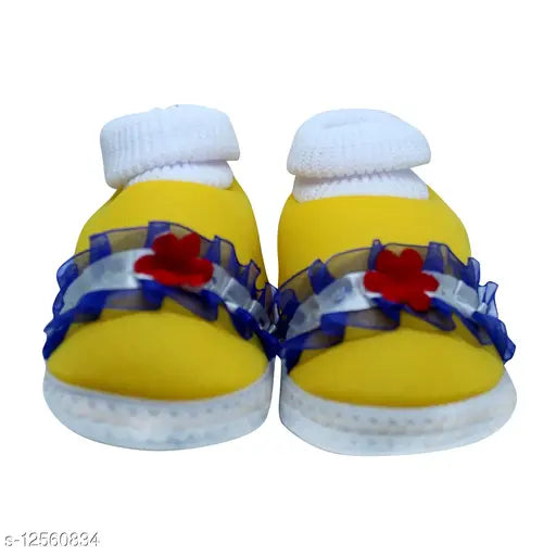 Yellow flower-patterned socks for baby shoes, yellow soles, blue and red trim