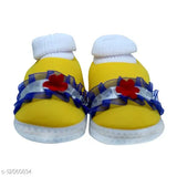 Yellow flower-patterned socks for baby shoes, yellow soles, blue and red trim