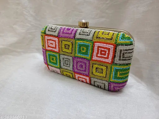 Multicolored geometric pattern embroidered on a clutch purse