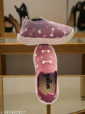 Children's casual sports shoes in purple with white dots and polka dot laces. Suitable for park walks, slip-ons, wearable for all day sports activities
