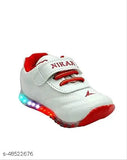 Red, white, and blue sports shoe with glowing accents and Nike logo