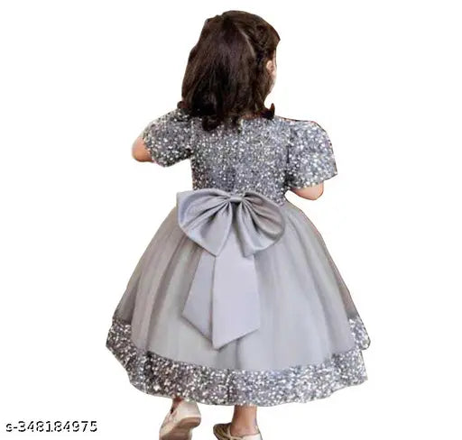 Embellished net and velvet wear for children, featuring short sleeves and intricate patterns. Indian-origin fashion for ages 2-9 years