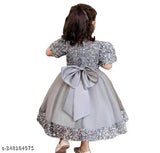 Embellished net and velvet wear for children, featuring short sleeves and intricate patterns. Indian-origin fashion for ages 2-9 years