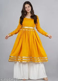 Women's traditional kameez sharara set in vibrant yellow with embroidered detailing