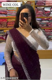 A woman in a traditional saree, showcasing its color and embroidery