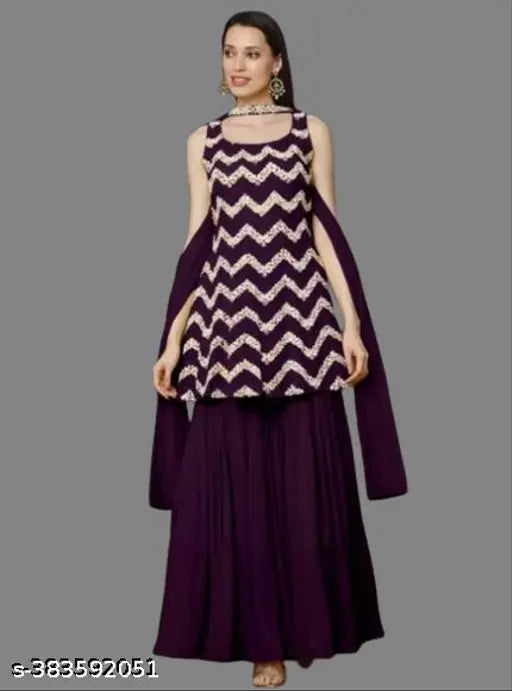 The image displays a traditional Indian outfit consisting of a kurta, sharara, and dupatta. The outfit is predominantly purple with white chevron patterns on the kurta and sharara, and is adorned with heavy embroidery. It is designed for women, as suggested by the style of the garments. The fabric appears to be a lightweight material suitable for wearing during various celebrations or formal events