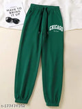 The image shows a pair of green stretchy jogging pants with a slim fit design. It's part of casual women's wear, suitable for summer or winter seasons. The straight and relaxed fit style suggests comfort and ease of movement