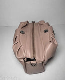 Tan shoulder bag with ruffled edge, metal zipper