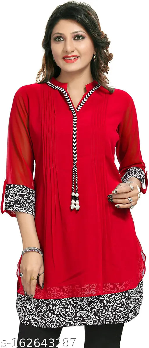 A woman in a red, solid, knee-length kurta with white embroidery on the neckline