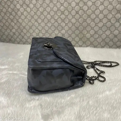 A small blue sling bag with zip closure and a chain strap, suitable for casual outings