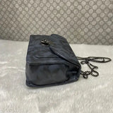 A small blue sling bag with zip closure and a chain strap, suitable for casual outings