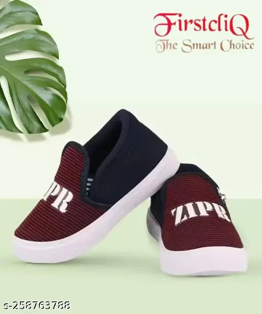 A pair of maroon kids shoes with zip closure and a white logo on the side