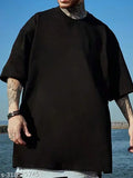 Mens black oversized graphic printed cotton T-shirt, large fit for men's fashion with short sleeves and a vibrant design