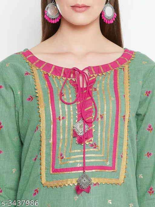 Women's printed cotton kurta set with palazzo pants, three-quarter sleeves in vibrant Indian pattern