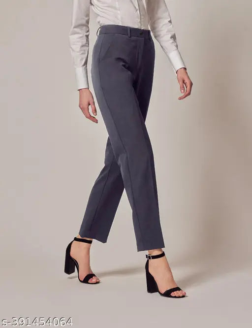 Dark grey formal trousers with a pointed toe and black strappy heels