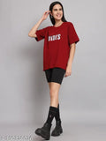 A person wearing a large, baggy red t-shirt with the word "vibes" printed on it