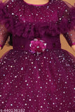 Purple glittery dress with ruffled sleeves, lace embellishments, and a floral brooch at waist