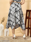 The skirt is asymmetrical with a pattern of black squares, reaching mid-thigh length