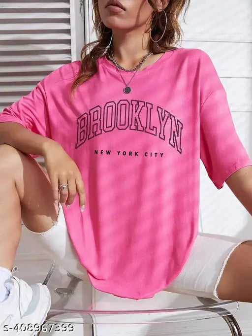 Oversized drop shoulder round neck t-shirt in bright pink, with brand name 'Brooklyn' on front
