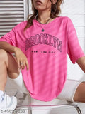 Oversized drop shoulder round neck t-shirt in bright pink, with brand name 'Brooklyn' on front