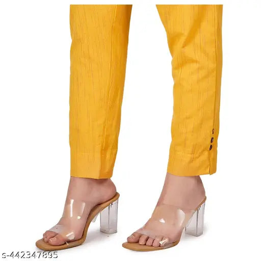 Combination of three trousers in yellow fabric, featuring zip closures