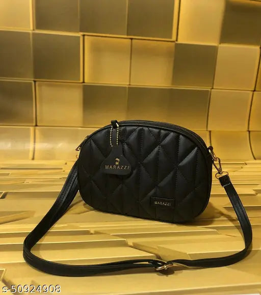 Black faux leather shoulder sling bag with zip closure, 3 visible pockets, strap length adjustable