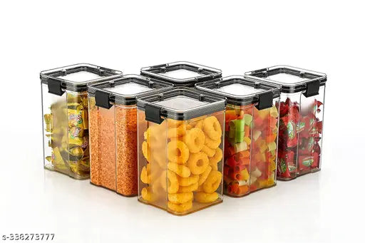 Six clear plastic airtight fridge storage containers, with food items, for organizing pasta and groceries in kitchen