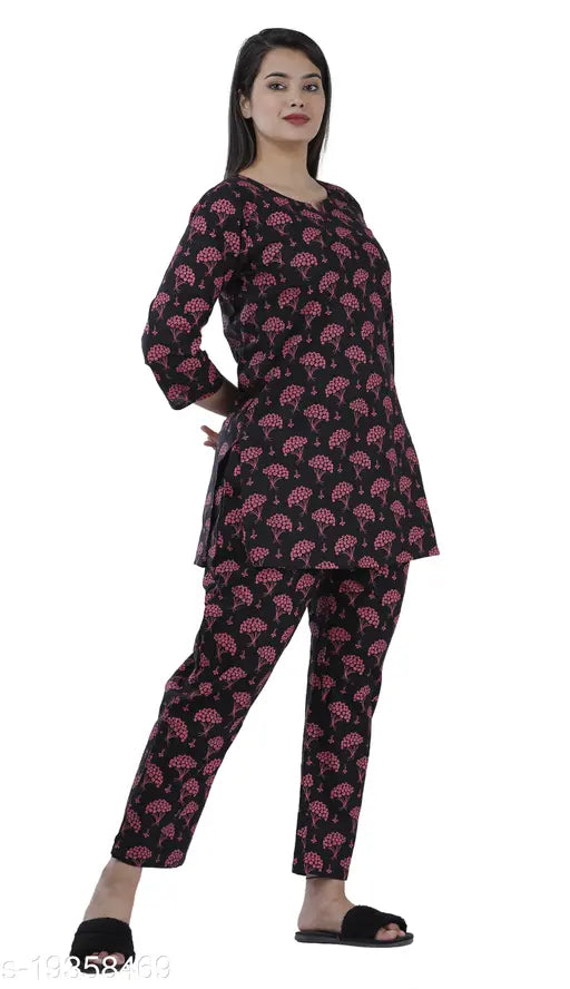 Black cotton p.buta flower print night suit for women, featuring three-quarter sleeves and pyjama style bottoms in size M (38" bust, 28" waist, 42" hip). Made in India