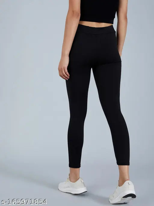 Solid black polyester jeggings for women & girls, stylish and available in sizes 26, 28, 30, 32, 34 (w/ 26in waist, 37in length)