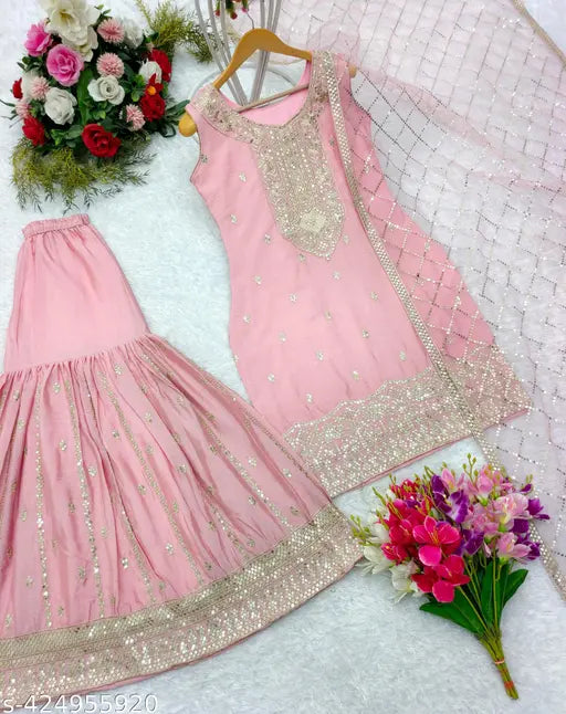 The image displays a set of women's clothing, specifically a long-sleeved top and a matching dupatta. The fabric appears to be heavy chiffon with a light sheen, suitable for formal wear. It has intricate embroidery and is fully stitched, suggesting it is ready to wear. The color of the set is pink, and there are visible sequins or embellishments on both pieces