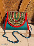 Teal and red striped woven handbag