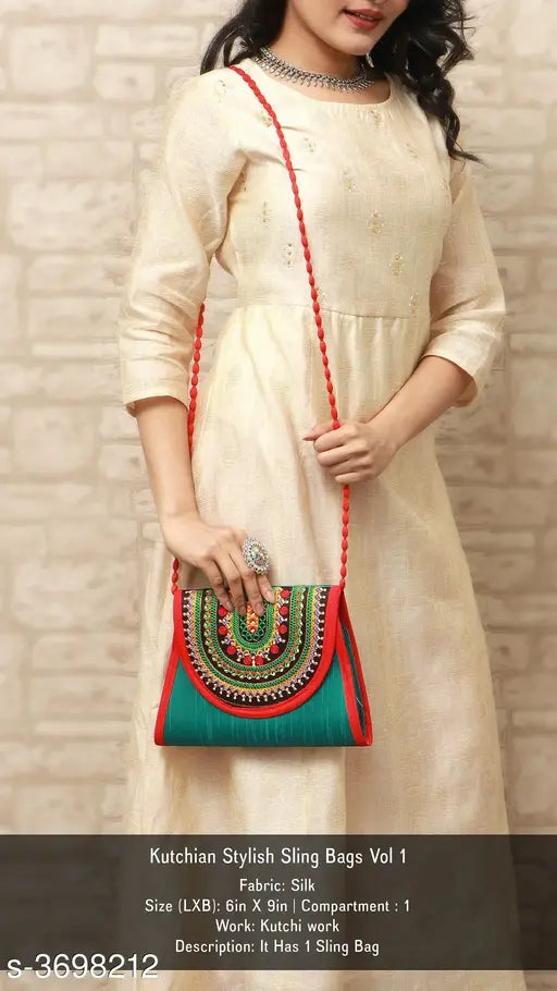 Trendy silk sling bag with vibrant red trim and embellishments