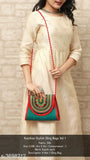 Trendy silk sling bag with vibrant red trim and embellishments
