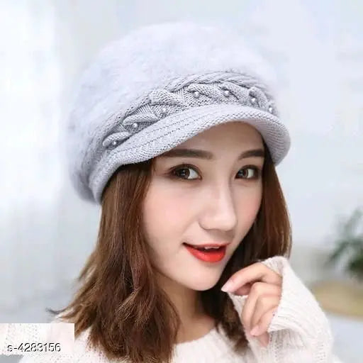 Gray knit cap with a round brim, worn by someone with red lipstick