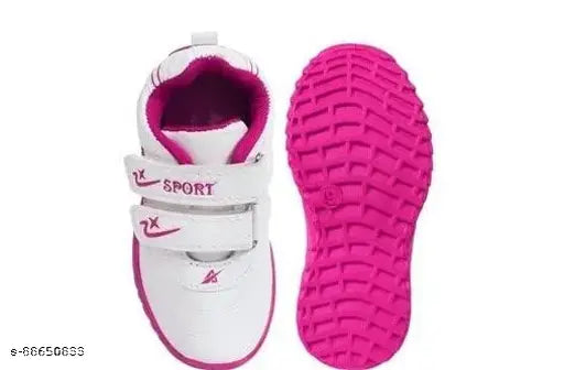 Pink running shoe with white sole, nike logo on side, size label on back, child's design