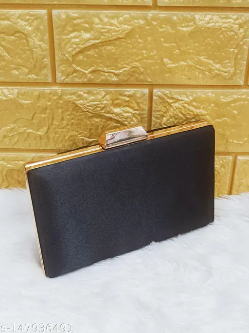 Black clutch with gold trim, perfect for formal events