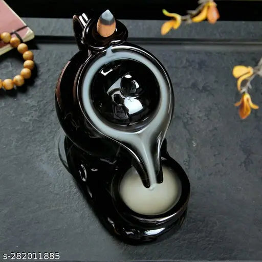 Black polyresin kettle-shaped incense holder with 10 backflow cones, ideal for home decor and positive energy