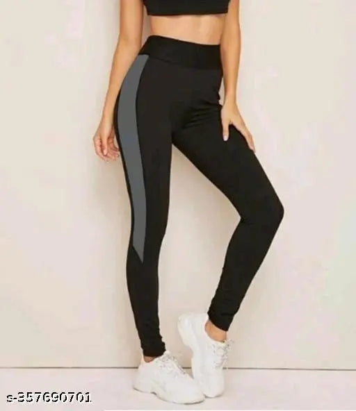 Black striped Lycra yoga leggings for women's workout, size 28-40 inches. Indian activewear brand for gym and yogawear